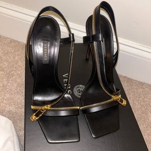 Brand new black Versace safety pin sandals.